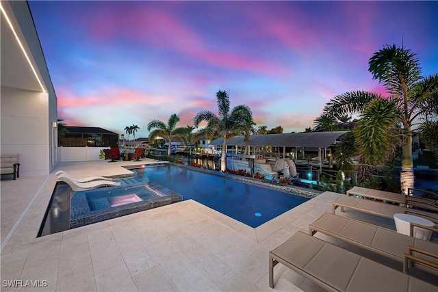 836 Miramar Ct, Cape Coral, FL 33904 - view of pool featuring a pool with connected hot tub, a dock, and a patio