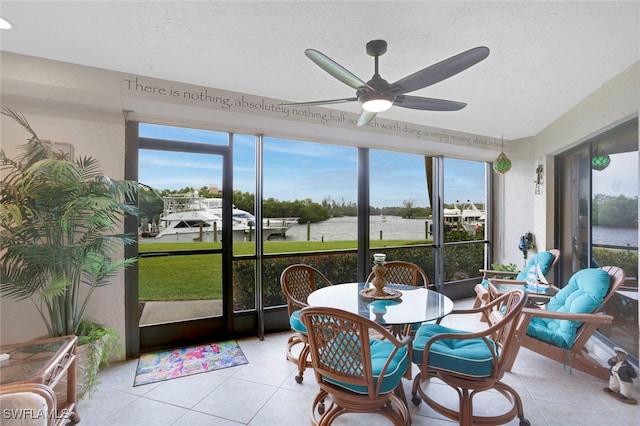 sunroom / solarium with a ceiling fan