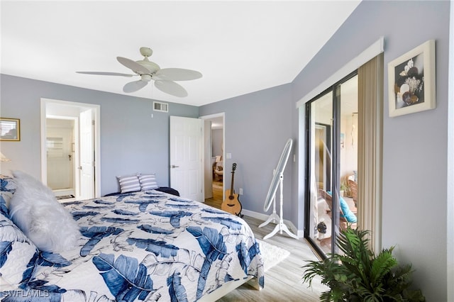 bedroom featuring a ceiling fan, light wood-style floors, visible vents, and baseboards