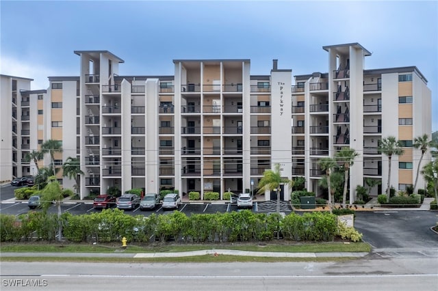 view of property with uncovered parking