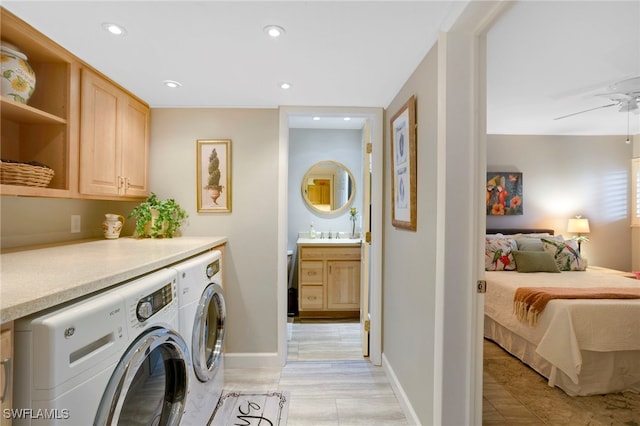 clothes washing area with baseboards, cabinet space, recessed lighting, ceiling fan, and independent washer and dryer