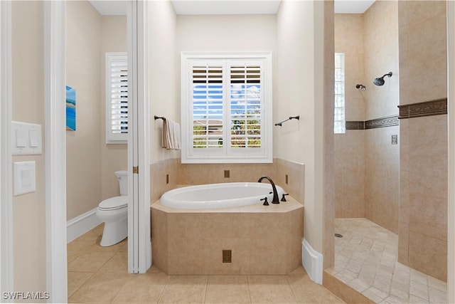 bathroom with tile patterned flooring, a garden tub, toilet, and walk in shower