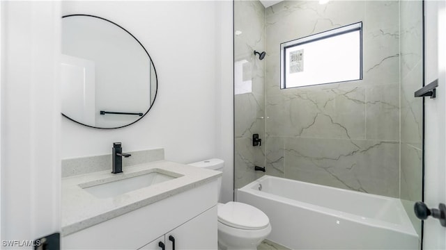 bathroom with tub / shower combination, toilet, and vanity