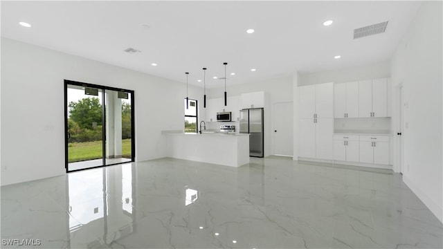 unfurnished living room with recessed lighting, visible vents, marble finish floor, and a sink