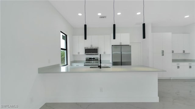 kitchen with marble finish floor, a sink, stainless steel appliances, white cabinets, and light countertops