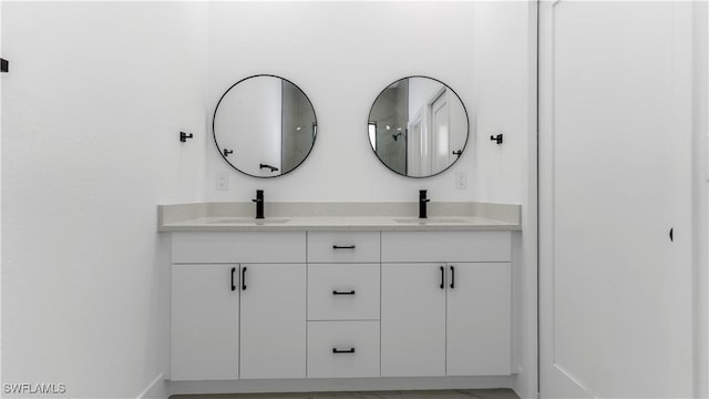 full bath featuring a sink and double vanity