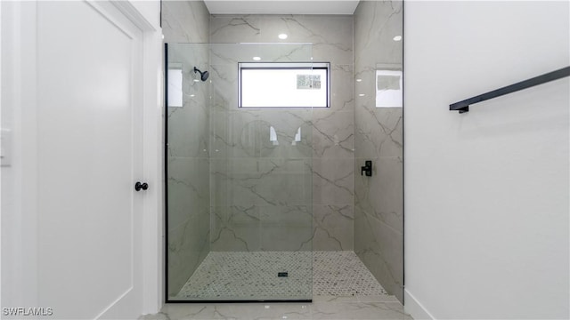 full bath featuring a marble finish shower