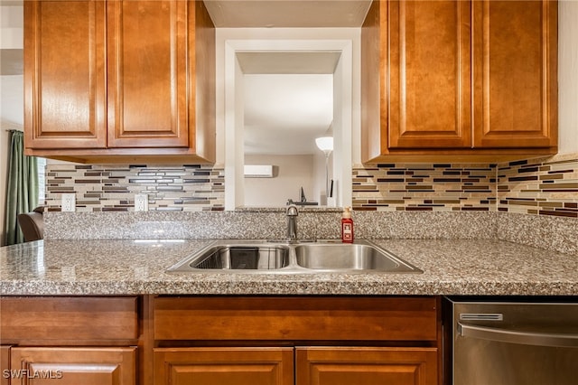 2184 Barry Dr, Fort Myers, FL 33907 - kitchen featuring a sink, backsplash, brown cabinets, and stainless steel dishwasher