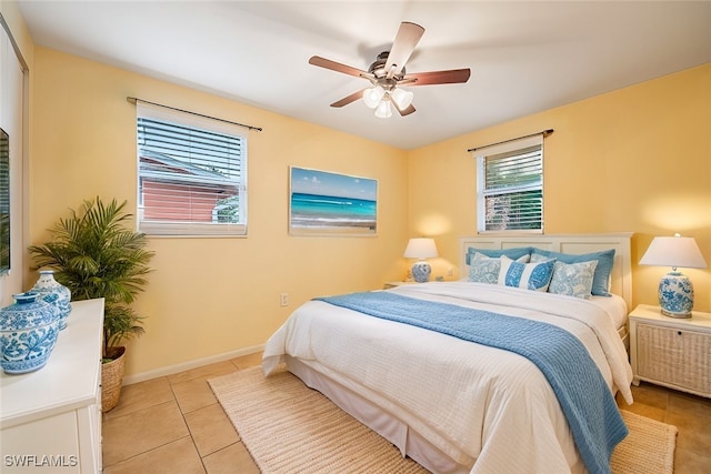 2184 Barry Dr, Fort Myers, FL 33907 - bedroom with light tile patterned floors, baseboards, and a ceiling fan