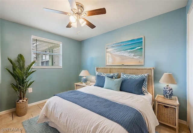 2184 Barry Dr, Fort Myers, FL 33907 - bedroom with light tile patterned floors, ceiling fan, and baseboards