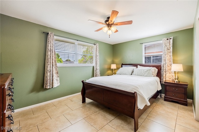 2184 Barry Dr, Fort Myers, FL 33907 - bedroom featuring light tile patterned floors, a ceiling fan, and baseboards