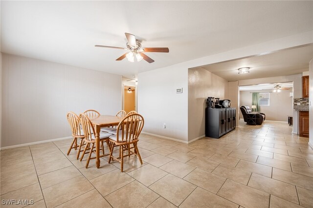 2184 Barry Dr, Fort Myers, FL 33907 - dining room with light tile patterned flooring, baseboards, and ceiling fan