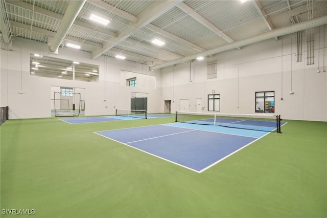 view of tennis court featuring community basketball court