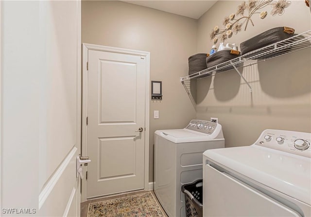 laundry room with washer and dryer and laundry area