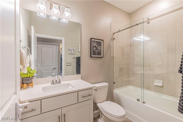 full bathroom featuring vanity, toilet, and enclosed tub / shower combo