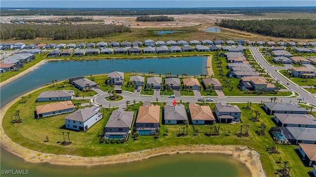 birds eye view of property featuring a residential view and a water view