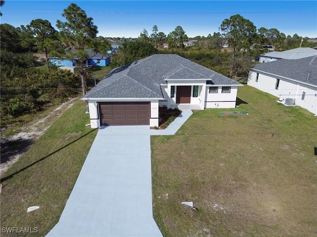 view of front facade featuring a front lawn, cooling unit, concrete driveway, a shingled roof, and a garage