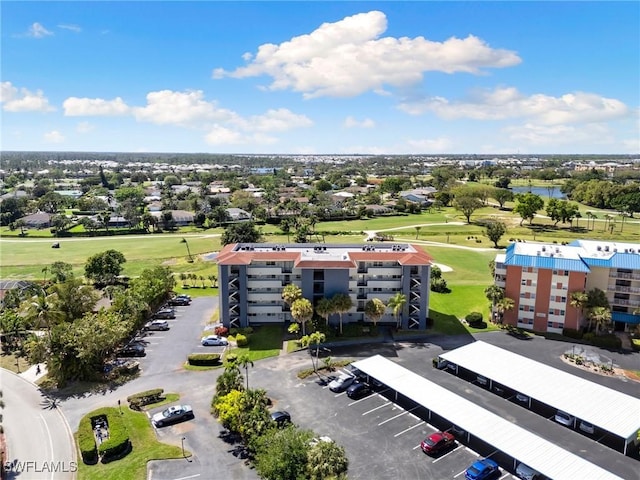 aerial view with view of golf course and a water view