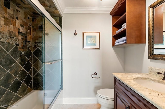 bathroom featuring vanity, baseboards, enclosed tub / shower combo, crown molding, and toilet