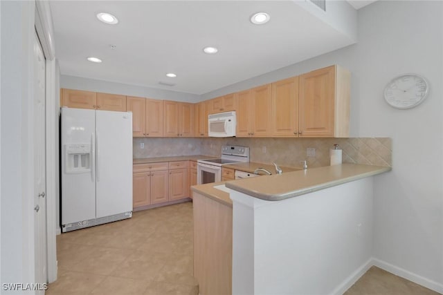 kitchen with backsplash, light brown cabinetry, light countertops, a peninsula, and white appliances