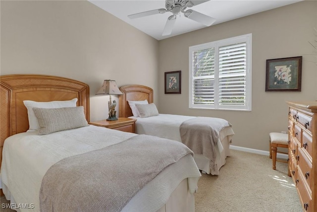 bedroom with baseboards, ceiling fan, and light colored carpet