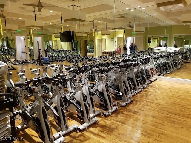 exercise room featuring wood finished floors