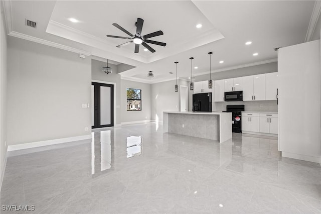 kitchen with open floor plan, black appliances, a raised ceiling, and visible vents