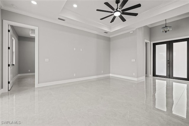 unfurnished room featuring visible vents, baseboards, ornamental molding, french doors, and a raised ceiling