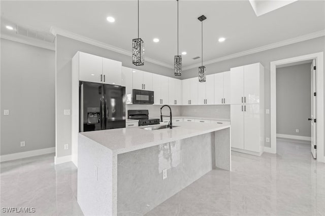 kitchen with a sink, black appliances, white cabinets, and crown molding