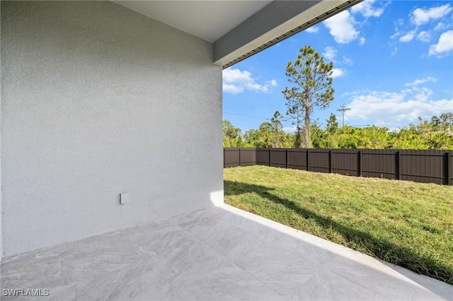 view of yard with a patio area and fence