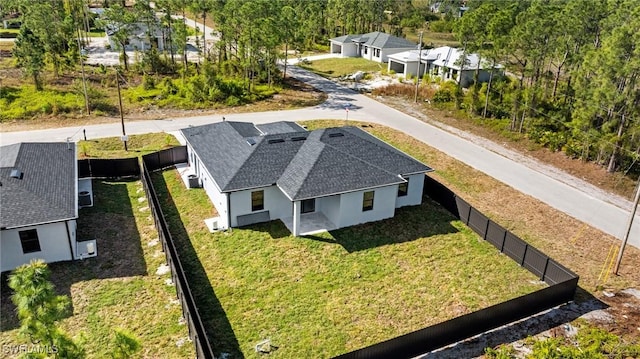 birds eye view of property with a residential view