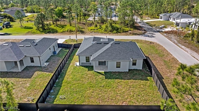 birds eye view of property with a residential view