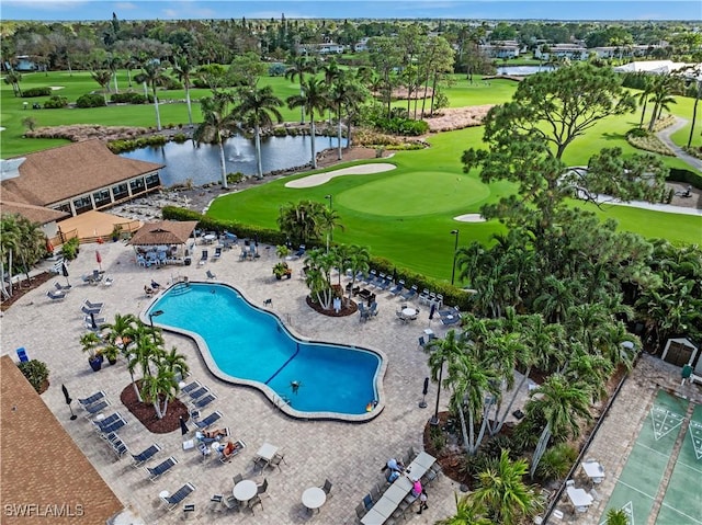 bird's eye view with golf course view and a water view