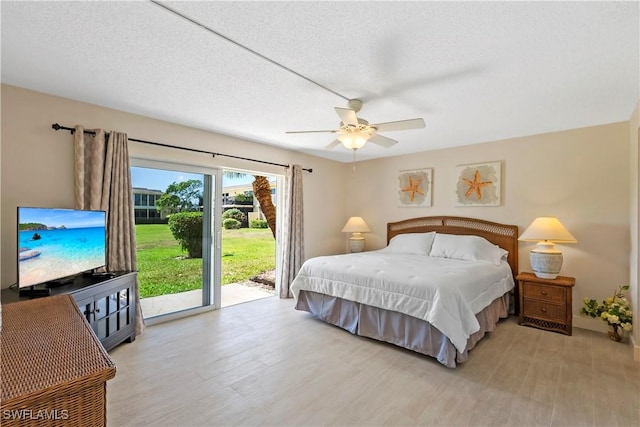 bedroom with light wood-style flooring, a textured ceiling, ceiling fan, and access to outside