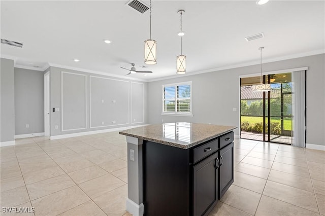 kitchen featuring visible vents and ornamental molding