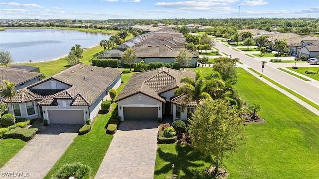 bird's eye view with a residential view and a water view