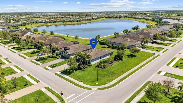 bird's eye view with a residential view and a water view