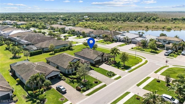 aerial view featuring a residential view and a water view