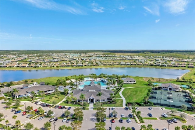 birds eye view of property with a residential view and a water view