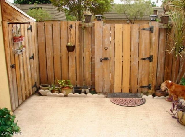 view of gate with fence