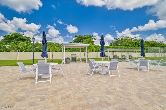 view of patio / terrace with outdoor dining area and fence