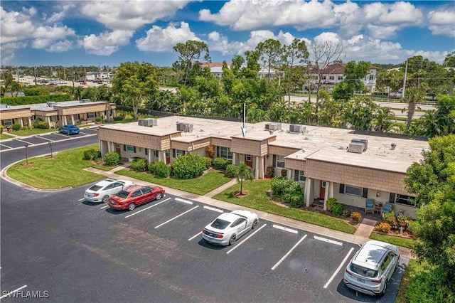 birds eye view of property with a residential view