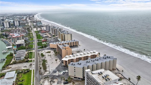 aerial view featuring a water view, a view of city, and a view of the beach