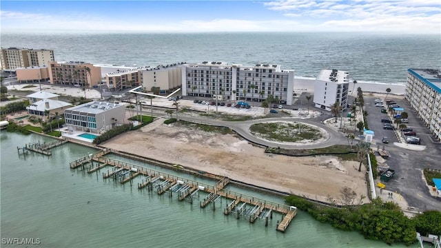 drone / aerial view with a view of city and a water view