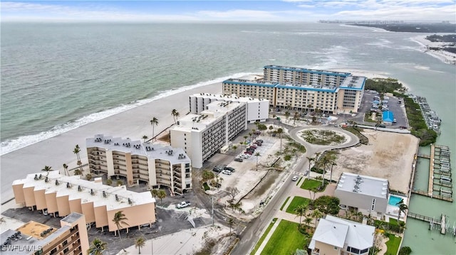 bird's eye view featuring a city view, a beach view, and a water view