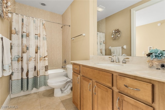 bathroom with tile patterned flooring, toilet, vanity, and shower / tub combo