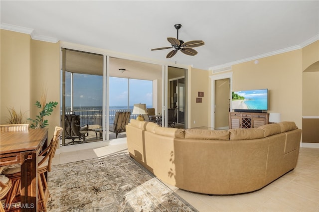 living area featuring a wall of windows, crown molding, and arched walkways