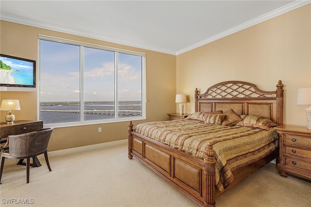 bedroom with crown molding, baseboards, and light carpet