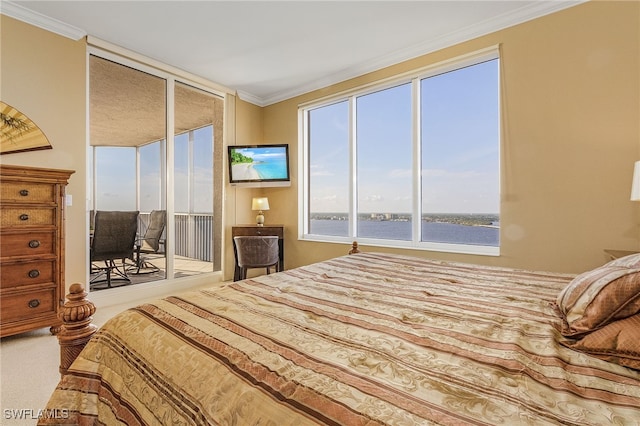 bedroom with access to exterior, crown molding, and carpet floors