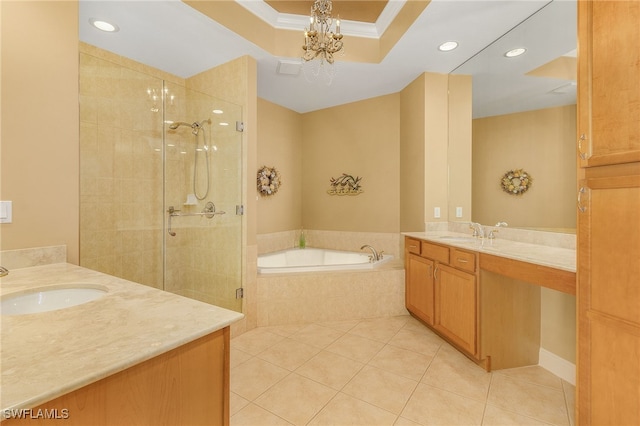 bathroom featuring two vanities, a shower stall, a garden tub, and a sink